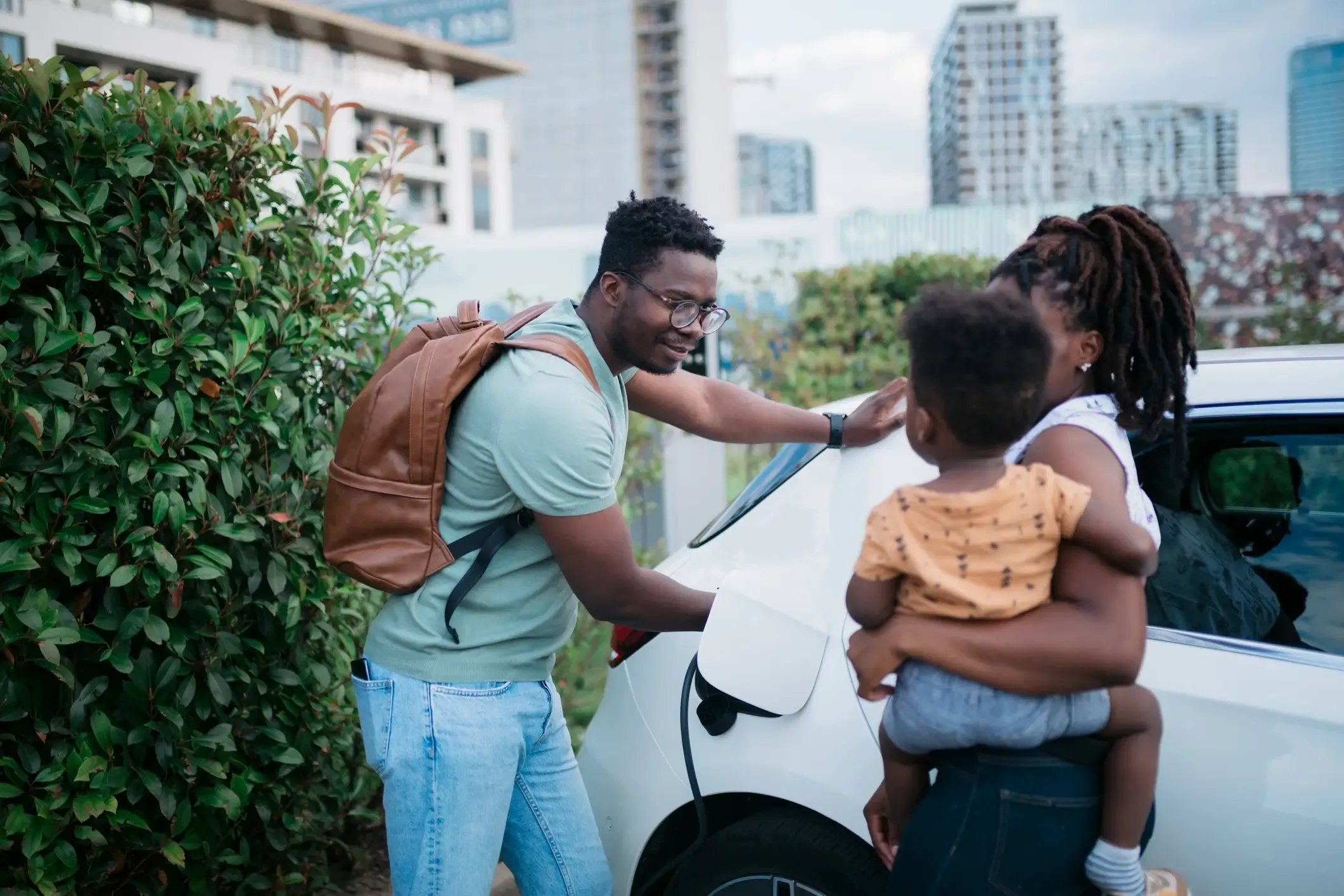 family charging an electric car
